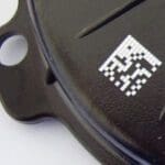 A close up of the logo on a remote control.