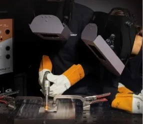 A person wearing gloves and working on something.