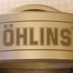 A close up of the lettering on a metal container.