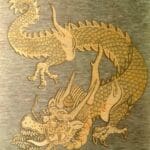A dragon is depicted on the wall of a building.