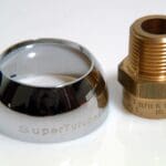 A close up of the inside of a ring and a brass nut