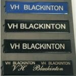A group of four name plates that are labeled vh blackinton.