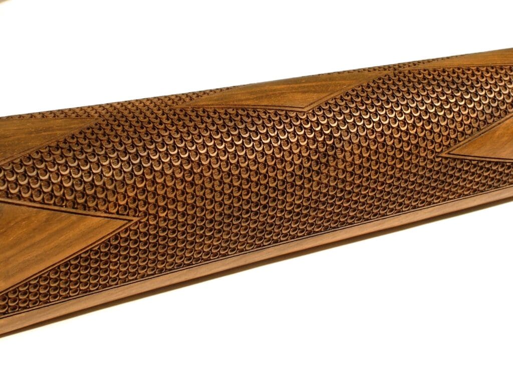 A wooden cane is shown with a pattern.