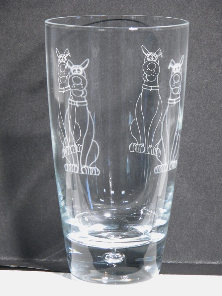 A glass with a picture of two dogs on it